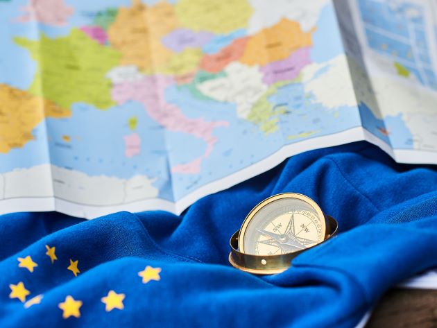 europe map, flag and compass